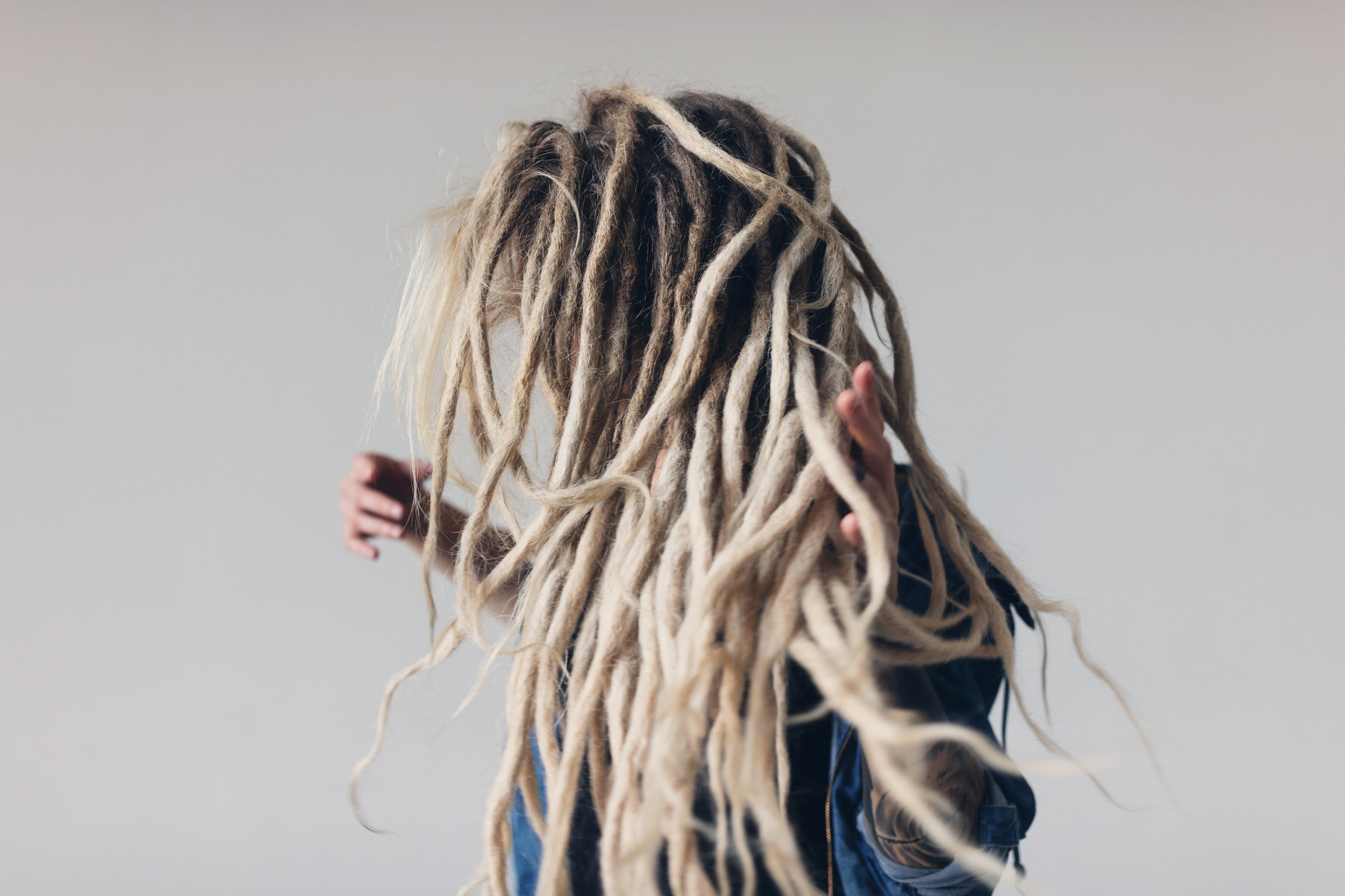 Young woman with blond dreadlocks